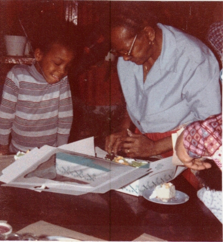 Mother and Reynoldo Jr. cutting Mothers Birthday cake. 